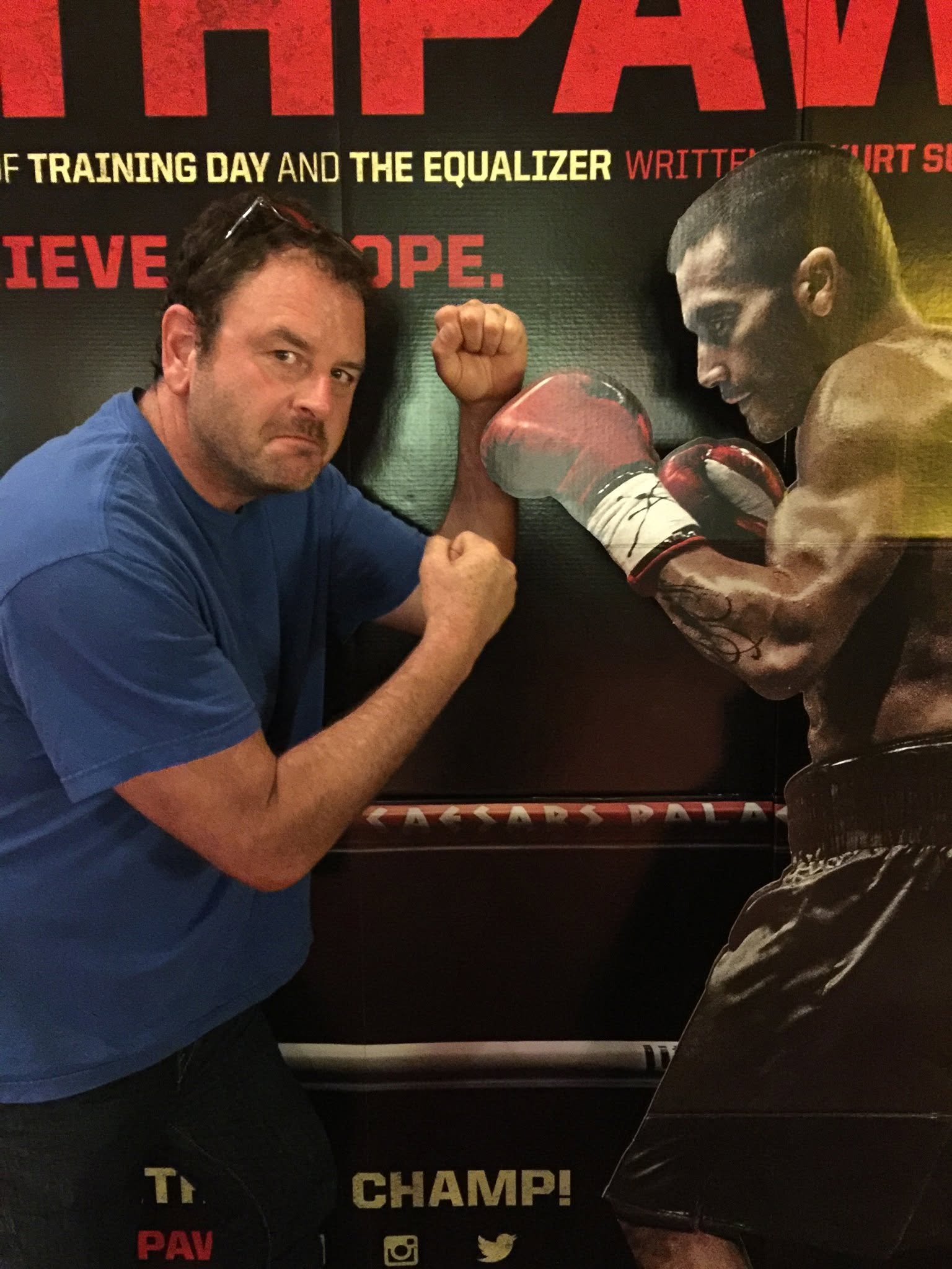 Steve playfully squaring up to a movie poster